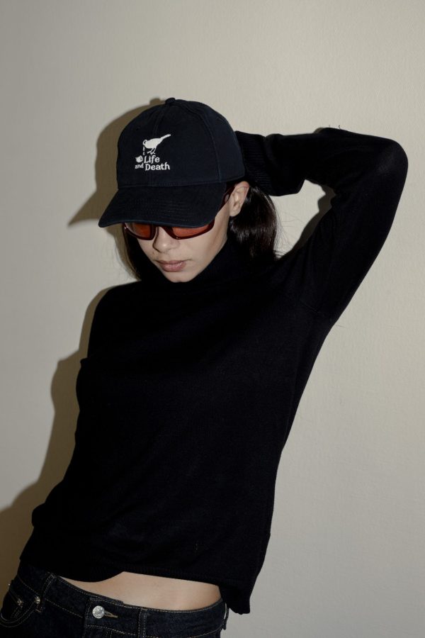 "Image of a stylish and sustainable Life and Death Iconic Logo x Harding Lane hat, made from 100% organic cotton, featuring an adjustable strap and contributing to environmental conservation with each purchase."